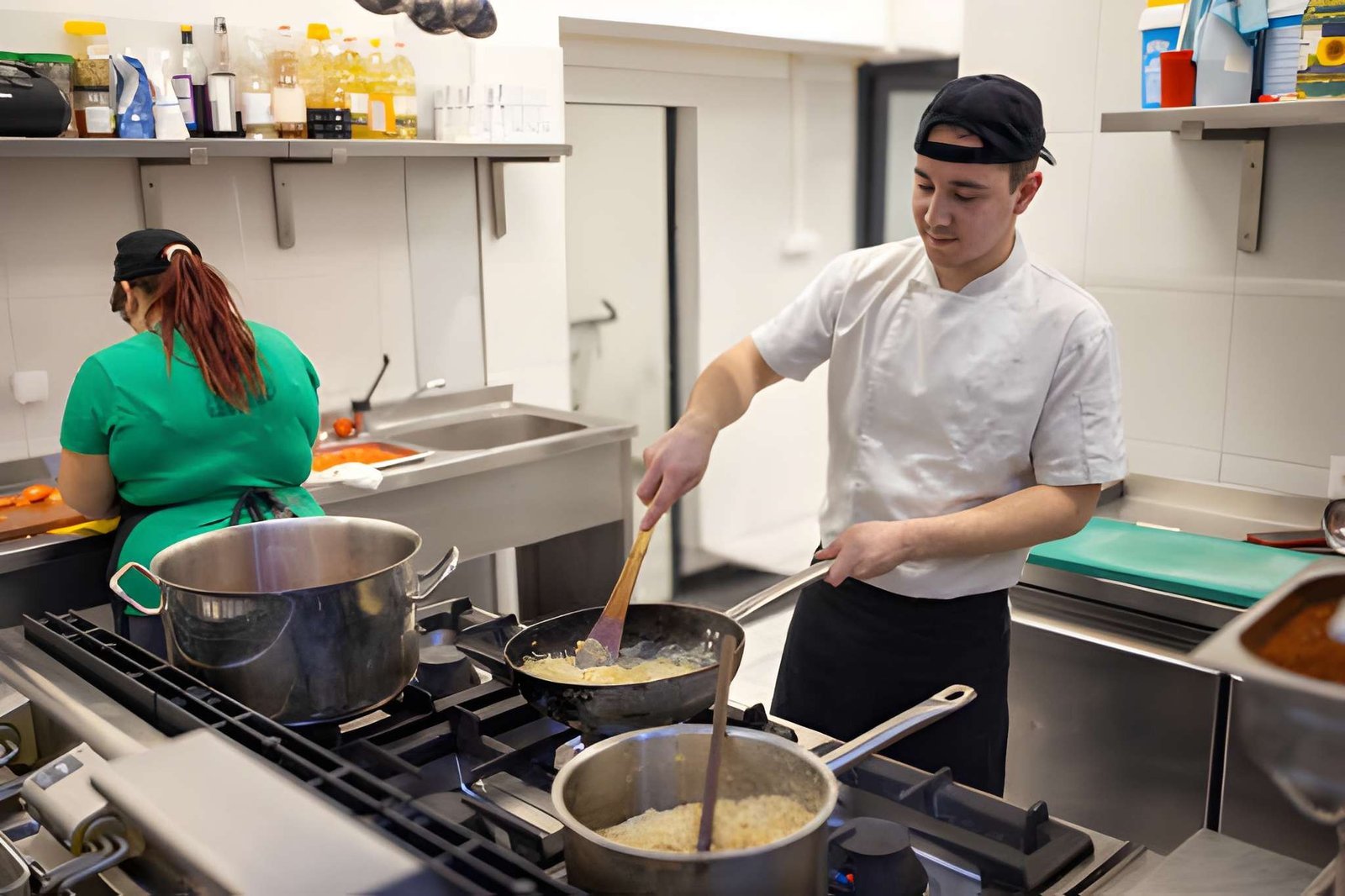 Chef working in a commercial kitchen demonstrating cookery skills for RPL assessment